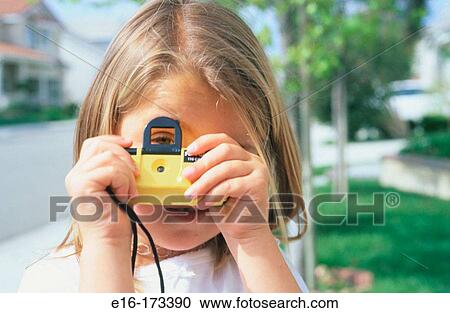 Stock Image - Girl photographing. Fotosearch