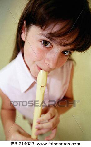 Girl playing flute View Large Photo Image Stock Image - Girl playing flute. Fotosearch