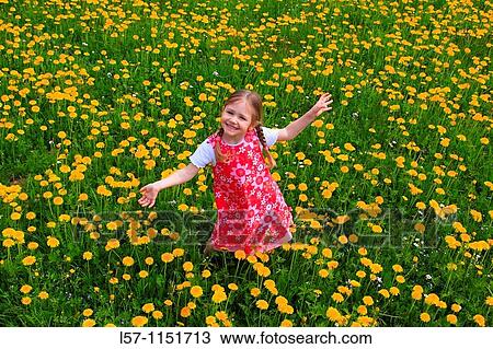 girl playing in field of Dandelions, Zuercher Oberland, Zuerich, Switzerland View Large Photo Image Stock Image - girl playing in field of Dandelions, Zuercher Oberland, Zuerich, Switzerland. Fotosearch