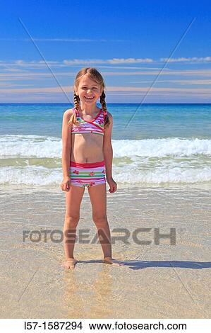 girl playing on sandy beach, Sutherland, Scotland View Large Photo Image Picture - girl playing on sandy beach, Sutherland, Scotland. Fotosearch