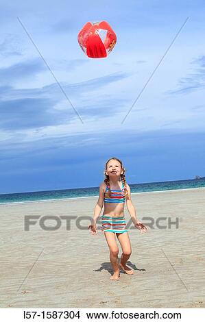 girl playing on sandy beach, Sutherland, Scotland View Large Photo Image Picture - girl playing on sandy beach, Sutherland, Scotland. Fotosearch