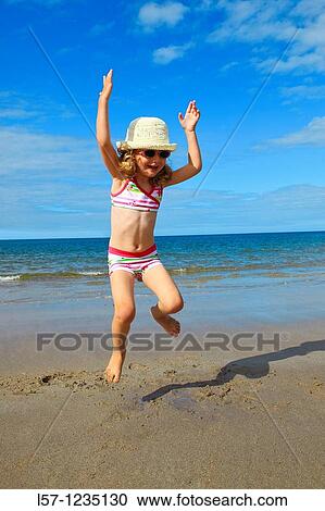 girl playing on sandy beach, Sutherland, Scotland View Large Photo Image Stock Image - girl playing on sandy beach, Sutherland, Scotland. Fotosearch