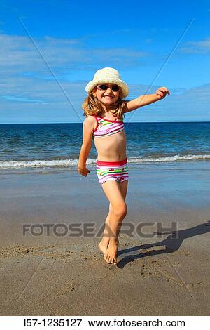 girl playing on sandy beach, Sutherland, Scotland View Large Photo Image Stock Photo - girl playing on sandy beach, Sutherland, Scotland. Fotosearch
