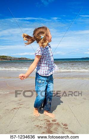 girl playing on sandy beach, Sutherland, Scotland View Large Photo Image Stock Photograph - girl playing on sandy beach, Sutherland, Scotland. Fotosearch