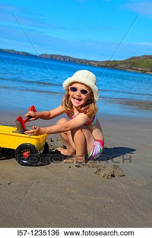 girl playing on sandy beach, Sutherland, Scotland View Large Photo Image Stock Photograph - girl playing on sandy beach, Sutherland, Scotland. Fotosearch
