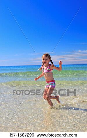 girl playing on sandy beach, Sutherland, Scotland View Large Photo Image Stock Photograph - girl playing on sandy beach, Sutherland, Scotland. Fotosearch