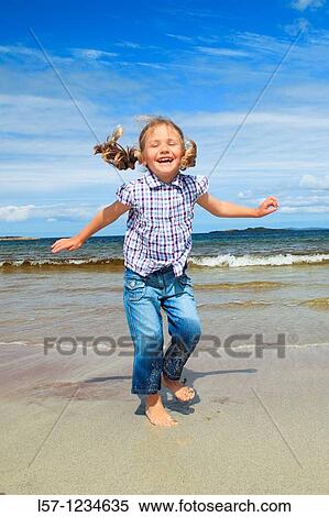 girl playing on sandy beach, Sutherland, Scotland View Large Photo Image Stock Photography - girl playing on sandy beach, Sutherland, Scotland. Fotosearch