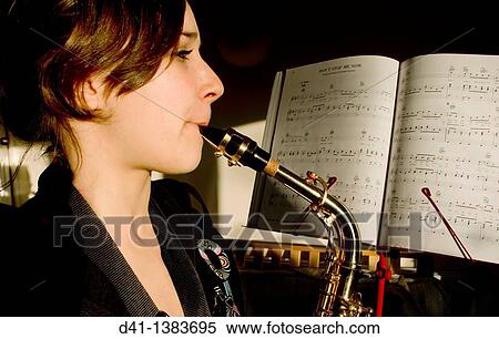 Girl playing saxophone View Large Photo Image Stock Photography - Girl playing saxophone. Fotosearch