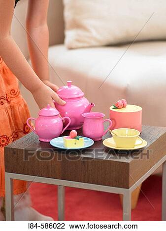 girl playing tea house with toys View Large Photo Image Stock Image - girl playing tea house with toys. Fotosearch