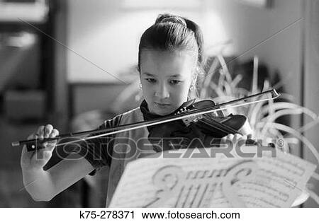 Stock Image - Girl playing violin. Fotosearch