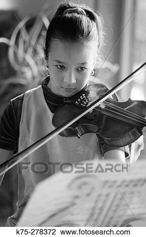 Stock Image - Girl playing violin. Fotosearch