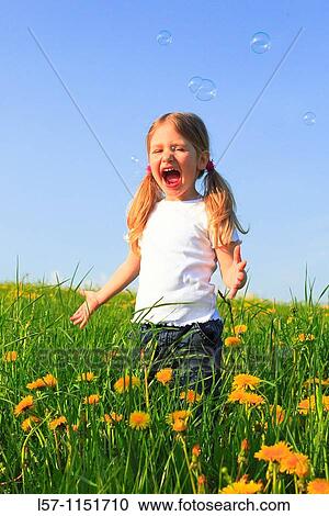 girl playing with bubbles in field of Dandelions, Zuercher Oberland, Zuerich, Switzerland View Large Photo Image Stock Image - girl playing with bubbles in field of Dandelions, Zuercher Oberland, Zuerich, Switzerland. Fotosearch
