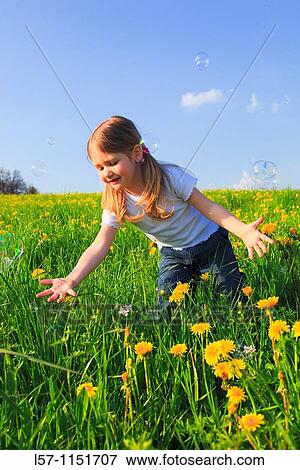 girl playing with bubbles in field of Dandelions, Zuercher Oberland, Zuerich, Switzerland View Large Photo Image Stock Photo - girl playing with bubbles in field of Dandelions, Zuercher Oberland, Zuerich, Switzerland. Fotosearch
