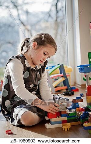 Girl playing with cubes indoor. View Large Photo Image Stock Image - Girl playing with cubes indoor.. Fotosearch