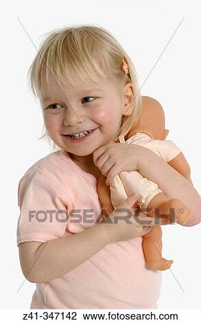 Girl playing with doll View Large Photo Image Stock Image - Girl playing with doll. Fotosearch