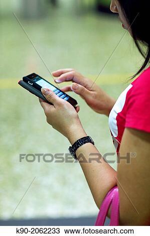 Girl playing with her smartphone, Hong Kong, China, East Asia. View Large Photo Image Stock Image - Girl playing with her smartphone, Hong Kong, China, East Asia.. Fotosearch