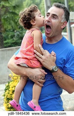 Girl playing with his father, Barcelona, Catalonia, Spain, Europe View Large Photo Image Stock Photograph - Girl playing with his father, Barcelona, Catalonia, Spain, Europe. Fotosearch