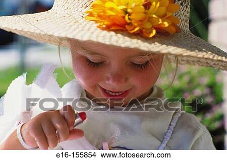 Girl playing with makeup View Large Photo Image Picture - Girl playing with makeup. Fotosearch