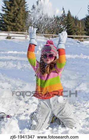 Girl playing with snow. View Large Photo Image Stock Photo - Girl playing with snow.. Fotosearch