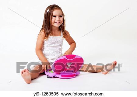 Girl playing with the computer View Large Photo Image Stock Photography - Girl playing with the computer. Fotosearch