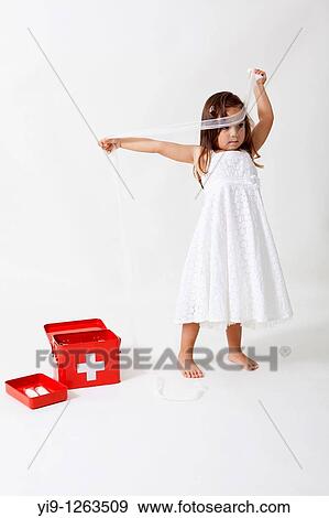 Girl playing with the kit cures View Large Photo Image Stock Photo - Girl playing with the kit cures. Fotosearch