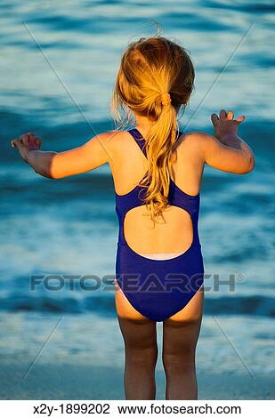 Girl plays at the beach, Cape Cod View Large Photo Image Stock Image - Girl plays at the beach, Cape Cod. Fotosearch