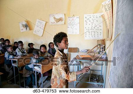 Girl pointing at the blackboard in a primary school in Adigrat. Ethiopia View Large Photo Image Stock Image - Girl pointing at the blackboard in a primary school in Adigrat. Ethiopia. Fotosearch