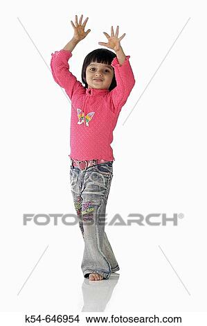 Picture - Girl posing with her hand raised.. Fotosearch