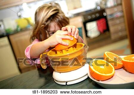Girl preparing orange juice View Large Photo Image Stock Image - Girl preparing orange juice. Fotosearch