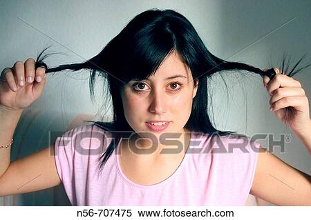 Girl Pulling her hair View Large Photo Image Stock Photography - Girl Pulling her hair. Fotosearch