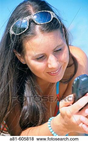 Girl reading a message View Large Photo Image Stock Photo - Girl reading a message. Fotosearch