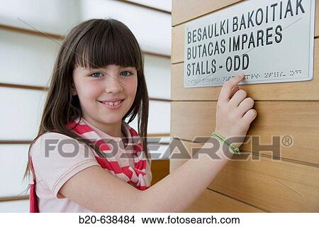 Girl reading sign in Braille system at Kursaal Center. San Sebastian, Guipuzcoa, Euskadi, Spain View Large Photo Image Picture - Girl reading sign in Braille system at Kursaal Center. San Sebastian, Guipuzcoa, Euskadi, Spain. Fotosearch