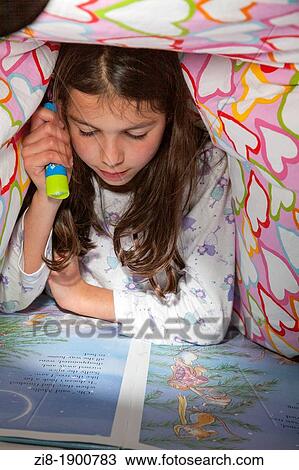 Girl reads in bed View Large Photo Image Stock Image - Girl reads in bed. Fotosearch