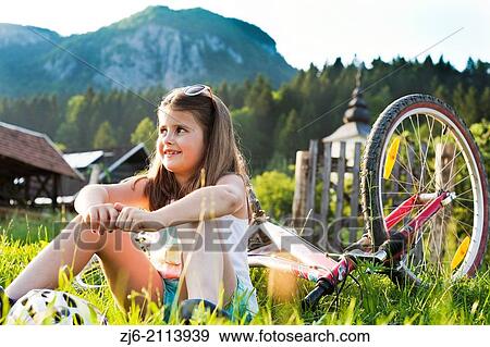 Girl resting and enjoying summer vacations in beautiful countryside, Bohinj Slovenia. View Large Photo Image Stock Photo - Girl resting and enjoying summer vacations in beautiful countryside, Bohinj Slovenia.. Fotosearch