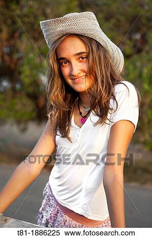 Stock Photography - girl resting on the field. Fotosearch