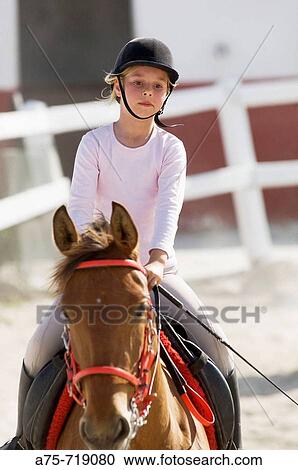 Girl riding horse View Large Photo Image Stock Image - Girl riding horse. Fotosearch