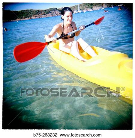 Girl rowing at the beach View Large Photo Image Stock Image - Girl rowing at the beach. Fotosearch