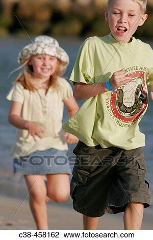 Girl Runnig After Boy View Large Photo Image Stock Image - Girl Runnig After Boy. Fotosearch
