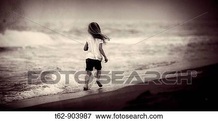 Girl running around the sea View Large Photo Image Stock Photo - Girl running around the sea. Fotosearch