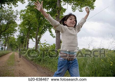 Girl running by tree-lined path. Arkaute, Alava, Euskadi, Spain View Large Photo Image Stock Photo - Girl running by tree-lined path. Arkaute, Alava, Euskadi, Spain. Fotosearch