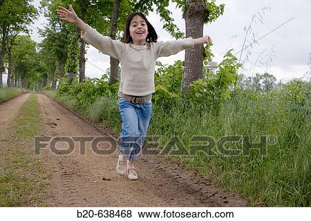 Girl running by tree-lined path. Arkaute, Alava, Euskadi, Spain View Large Photo Image Stock Photo - Girl running by tree-lined path. Arkaute, Alava, Euskadi, Spain. Fotosearch