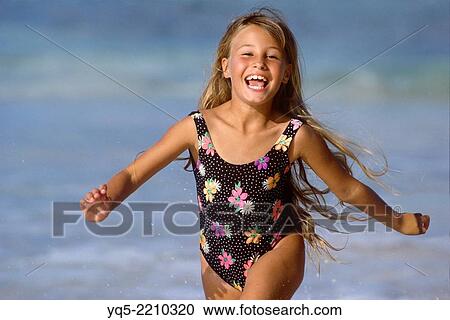 girl running in water. View Large Photo Image Stock Image - girl running in water.. Fotosearch