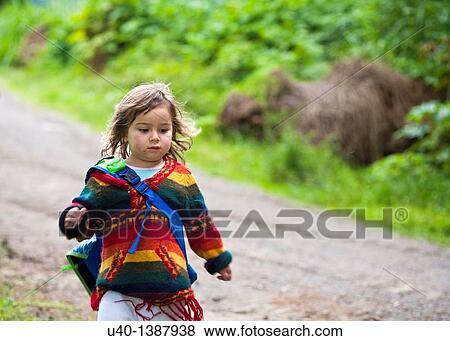 Stock Photo - Girl running on country road. Fotosearch