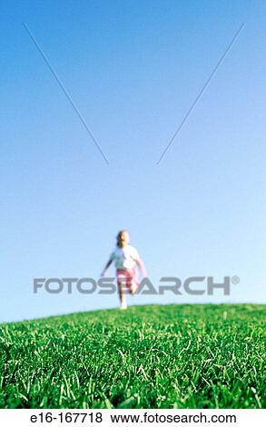 Girl running on hill View Large Photo Image Stock Photo - Girl running on hill. Fotosearch
