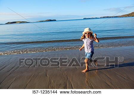 girl running on sandy beach, Sutherland, Scotland View Large Photo Image Picture - girl running on sandy beach, Sutherland, Scotland. Fotosearch