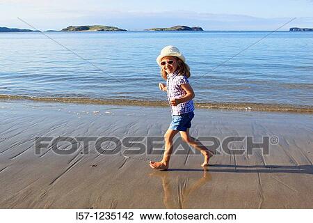 girl running on sandy beach, Sutherland, Scotland View Large Photo Image Stock Image - girl running on sandy beach, Sutherland, Scotland. Fotosearch