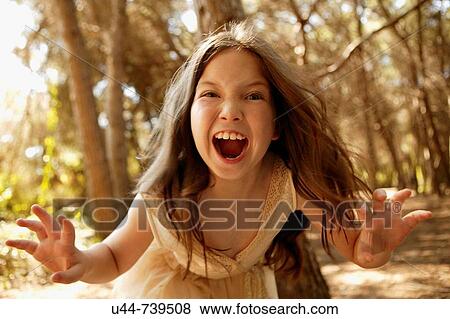 Stock Photo - Girl scaring the camera. Fotosearch