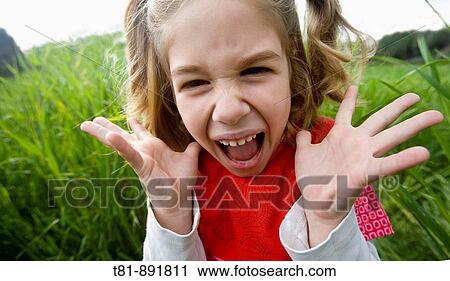 Stock Image - girl screaming in fear. Fotosearch
