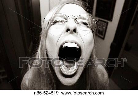 Girl screaming with mouth wide open View Large Photo Image Stock Photo - Girl screaming with mouth wide open. Fotosearch