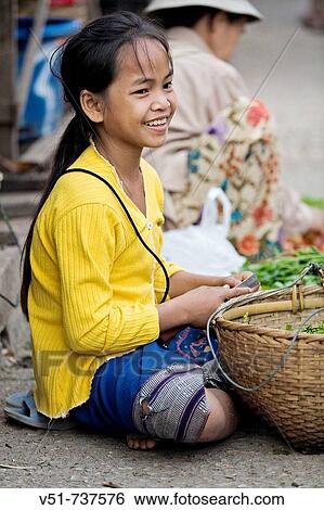 Girl selling in an asian market, Laos View Large Photo Image Stock Photograph - Girl selling in an asian market, Laos. Fotosearch
